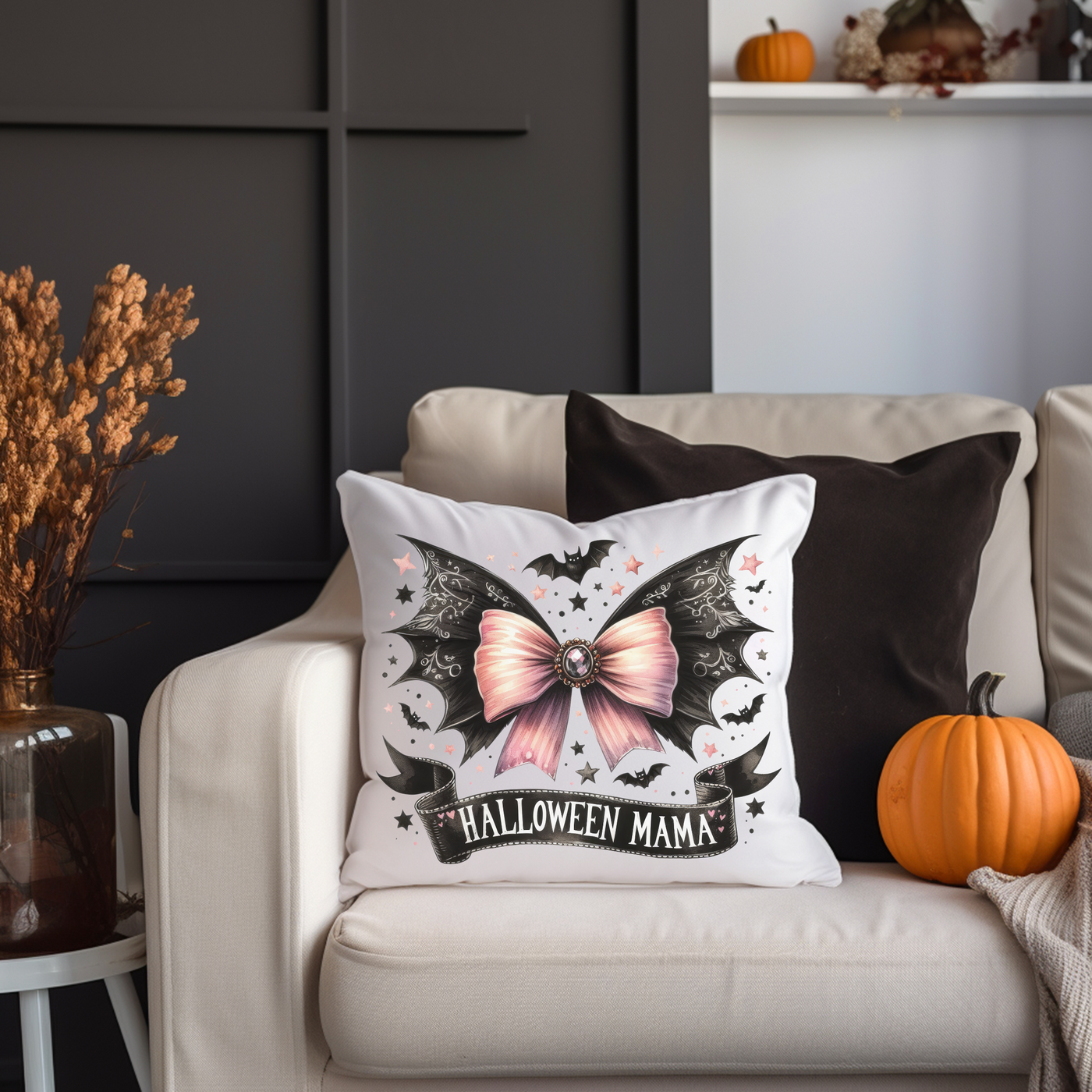 a white couch with a halloween pillow on it