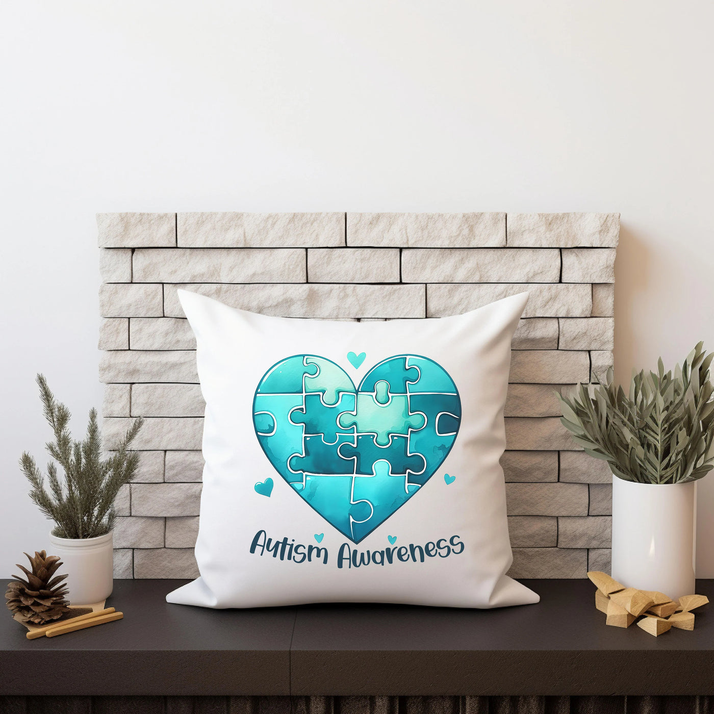 Autism Awareness pillow with blue puzzle heart design on mantel with plants