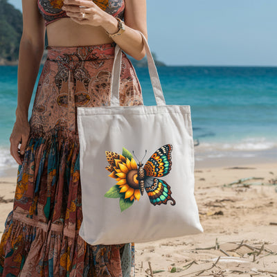 Woman on beach holding tote bag with sunflower and butterfly design