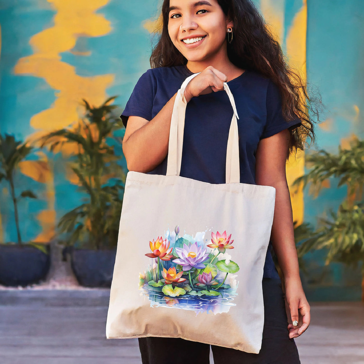 a woman holding a tote bag with flowers on it