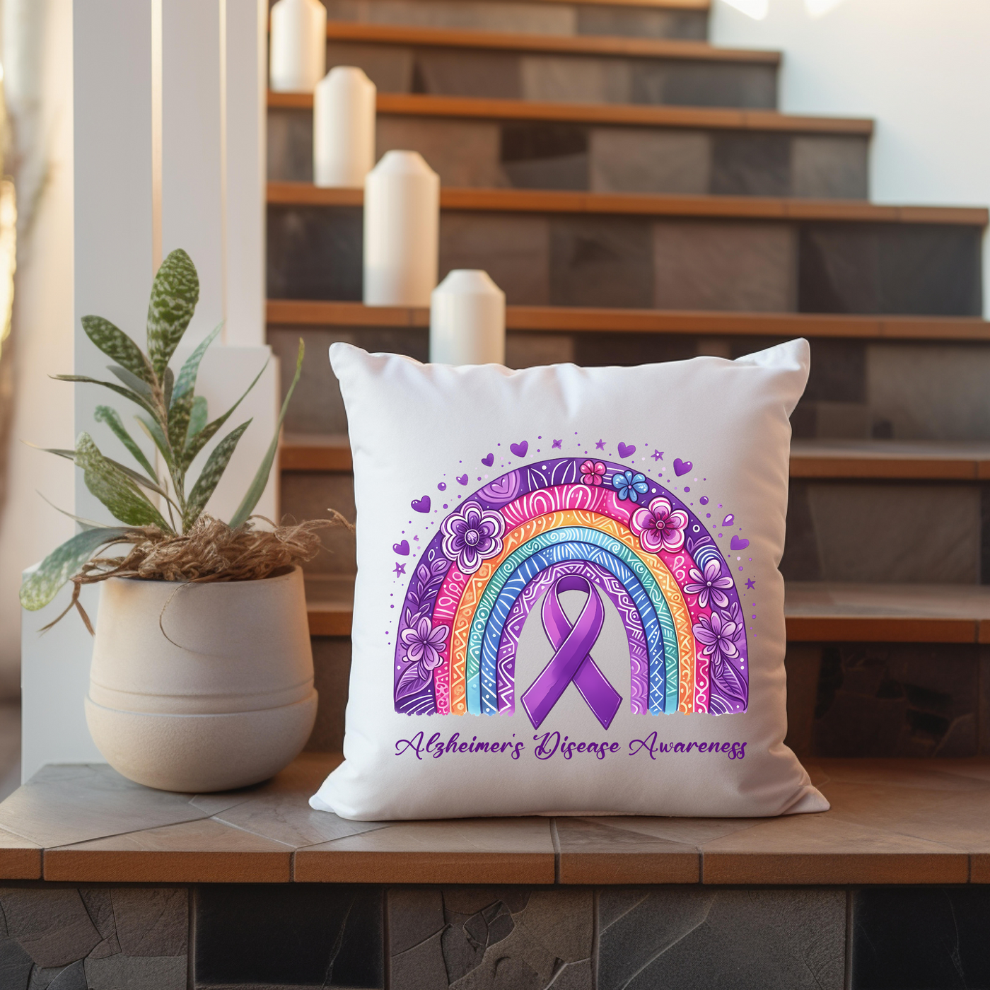 a pillow with a purple ribbon on it next to a potted plant