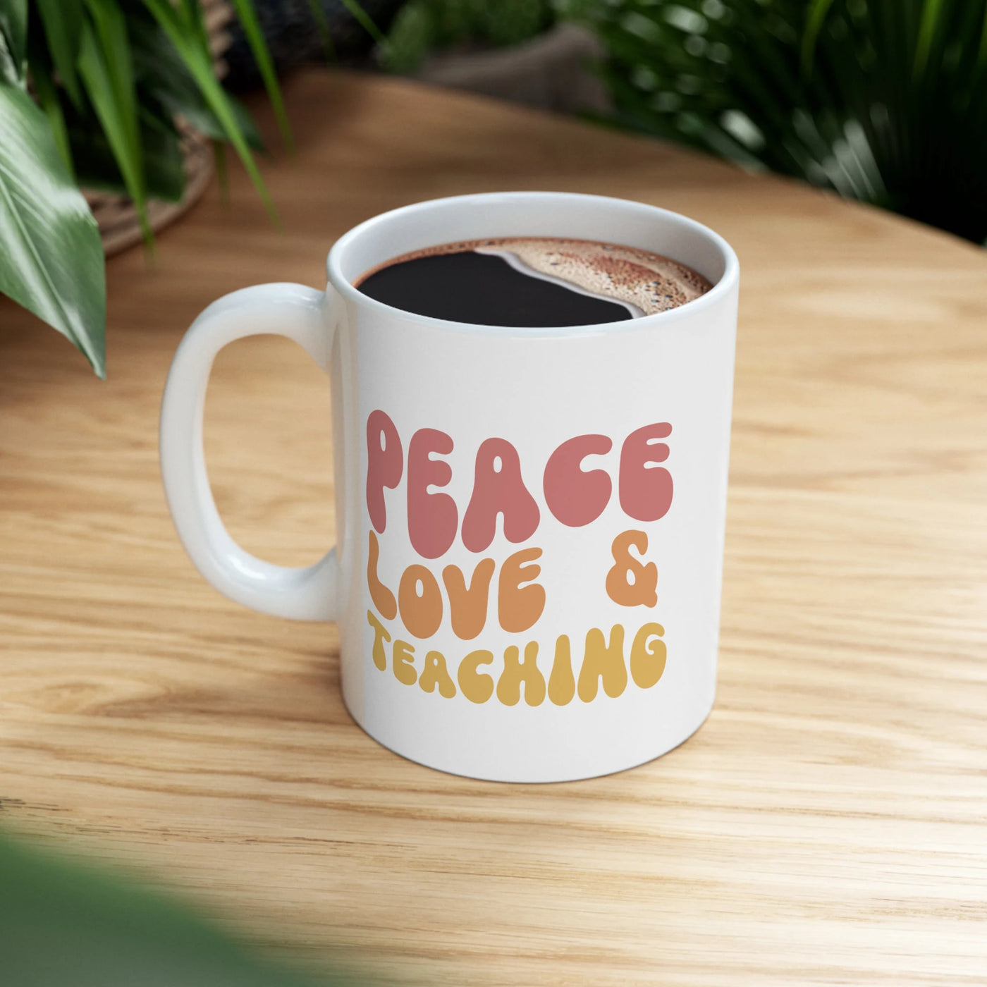 a cup of coffee sitting on top of a wooden table