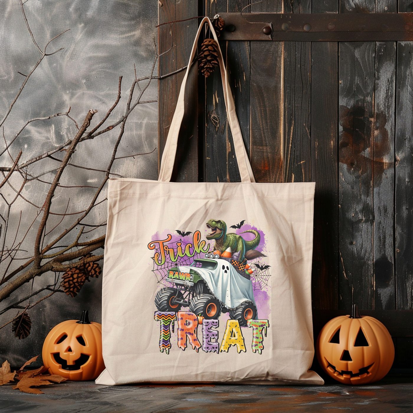 a trick or treat tote bag sitting next to two pumpkins