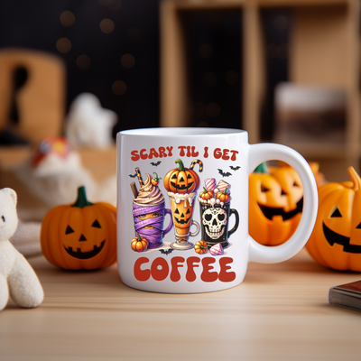 a coffee mug with a picture of a couple of pumpkins and a teddy bear