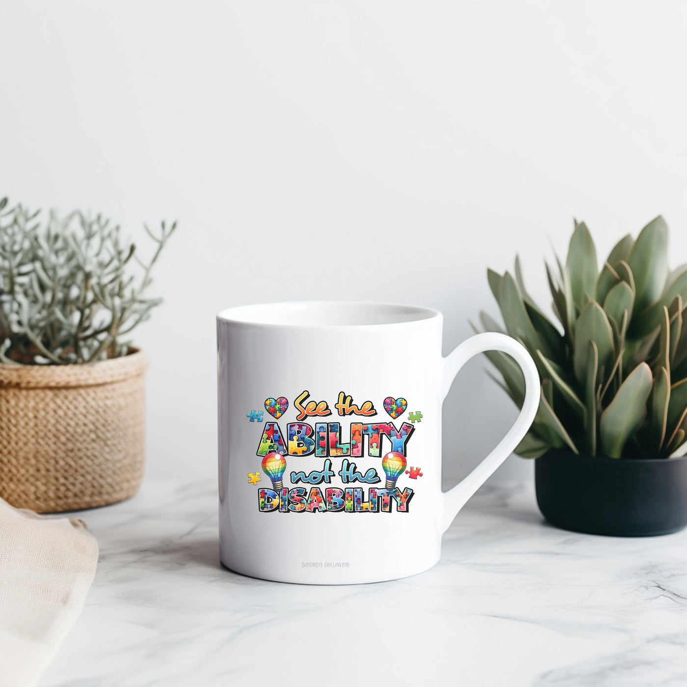 a white coffee mug sitting on top of a table