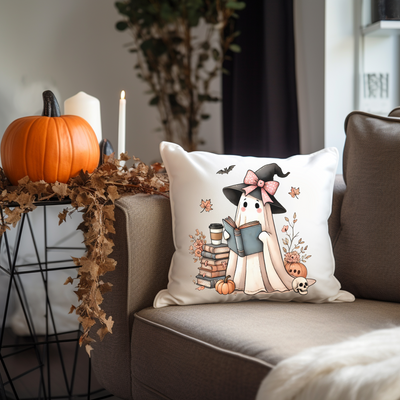 a couch with a pillow on it and a pumpkin in the background