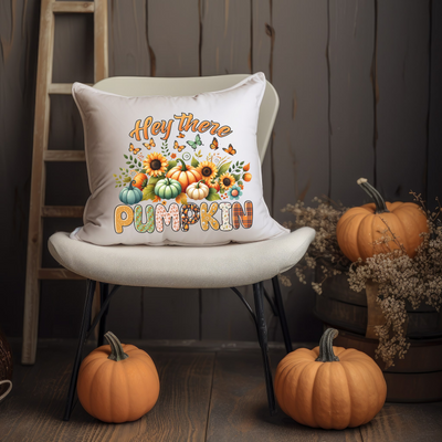 a chair with a pillow that says happy there is a pumpkin on it