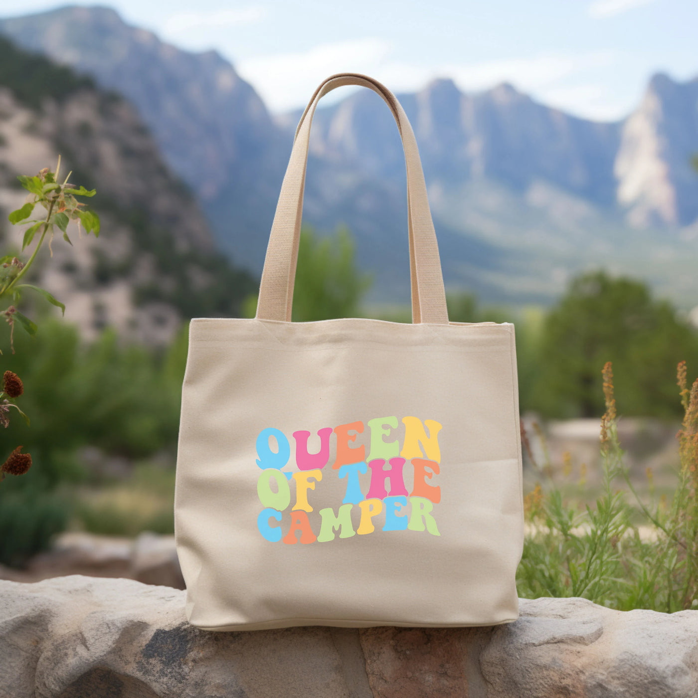 a tote bag sitting on top of a rock