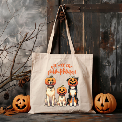 a tote bag with a picture of two cats and two pumpkins