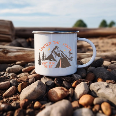 a white coffee mug sitting on top of a pile of rocks