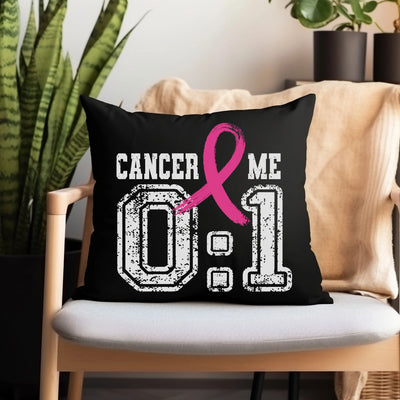 a black pillow with a pink ribbon on it