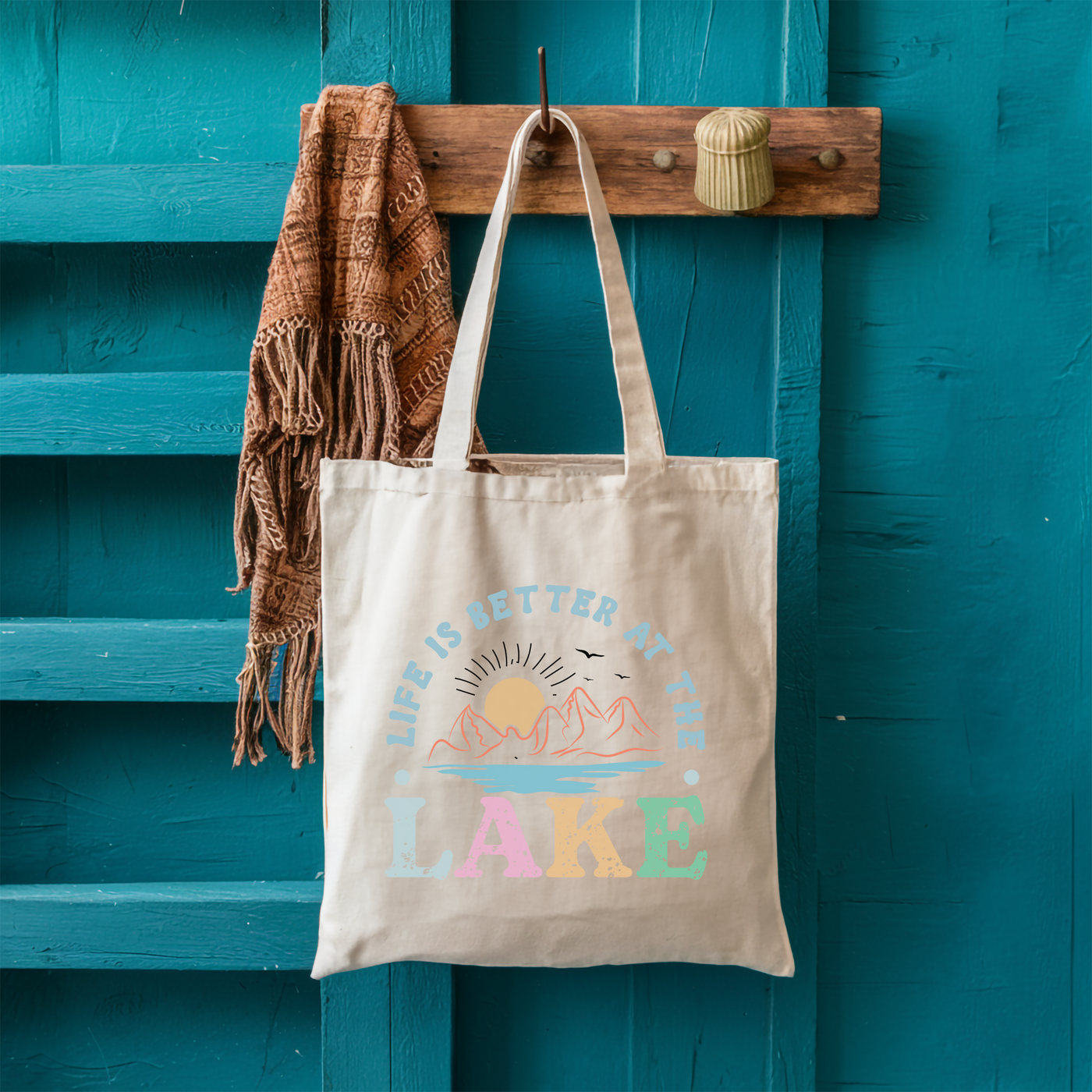 a tote bag hanging on a blue door