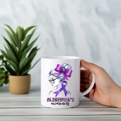 a person holding a coffee mug with a purple ribbon on it