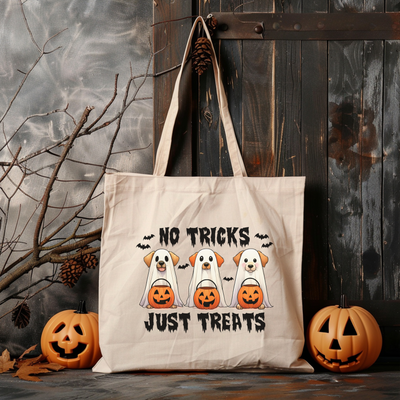 a trick is just treats tote bag next to pumpkins