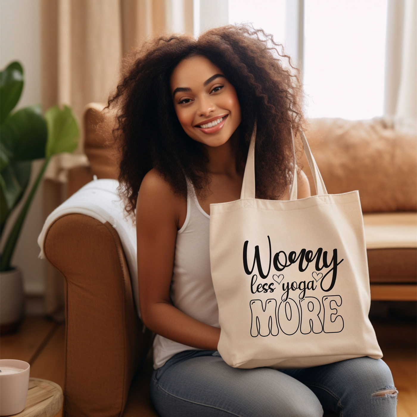 a woman sitting on a couch holding a tote bag