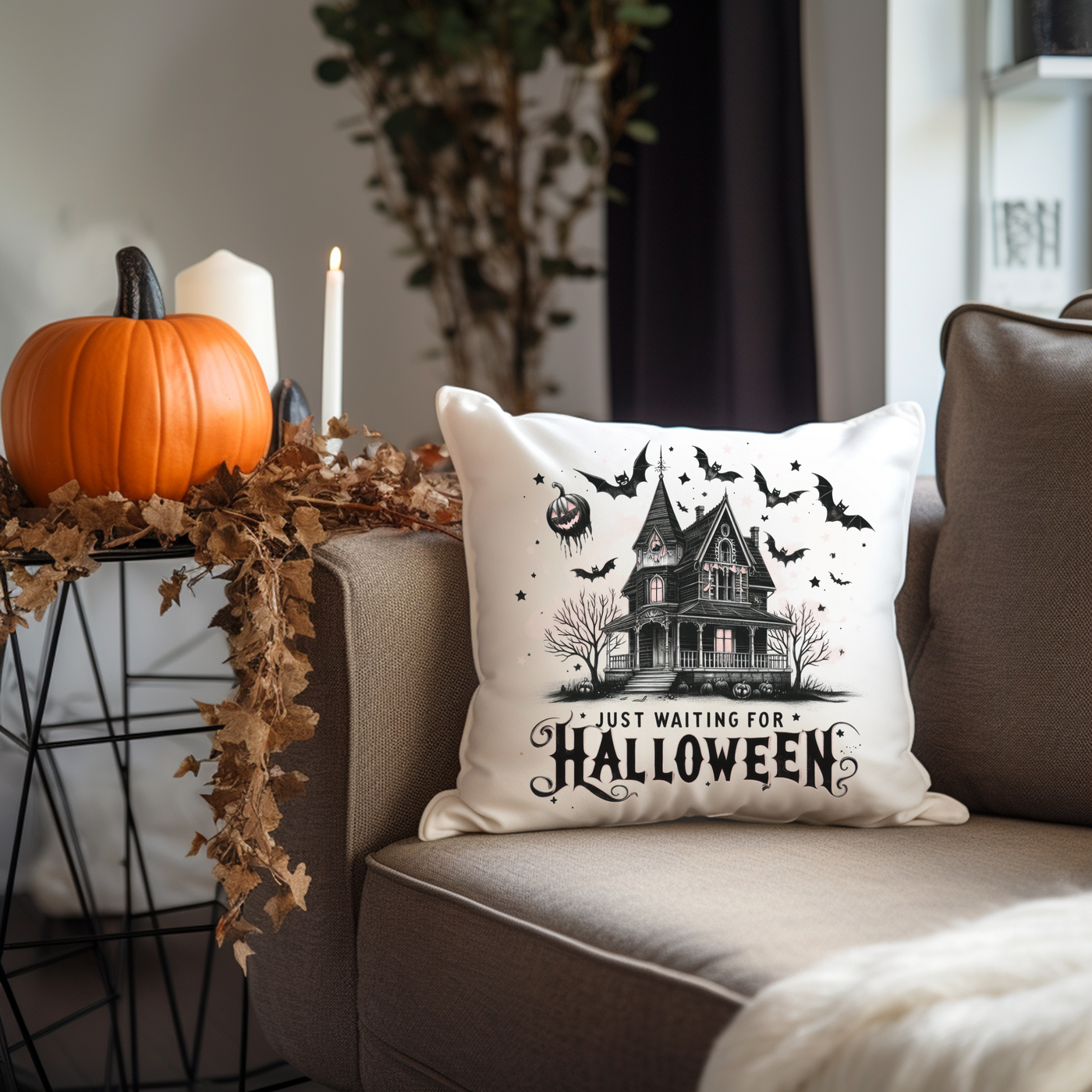 a halloween pillow sitting on top of a couch