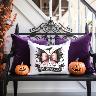 a bench with two pumpkins and a pillow on it