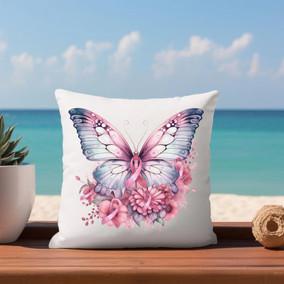 a white pillow with a pink butterfly on it