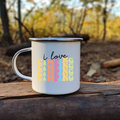 a white coffee mug with i love camping written on it