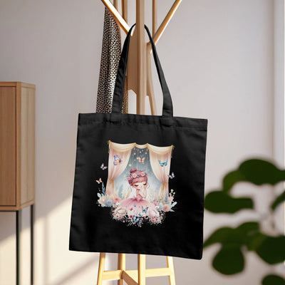 a black tote bag with a picture of a woman on it