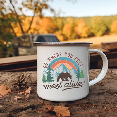 a white coffee mug sitting on top of a wooden table