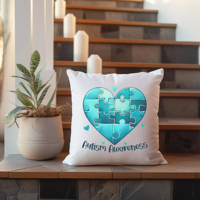 a white pillow with a puzzle heart on it