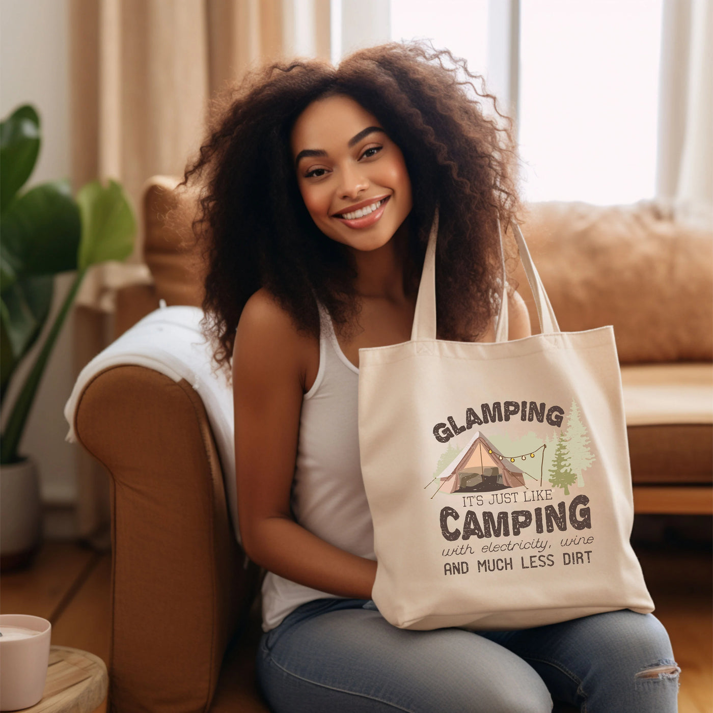 a woman sitting on a couch holding a bag