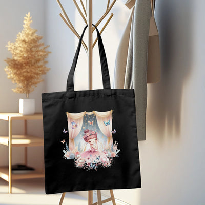 a black tote bag with a picture of a woman on it