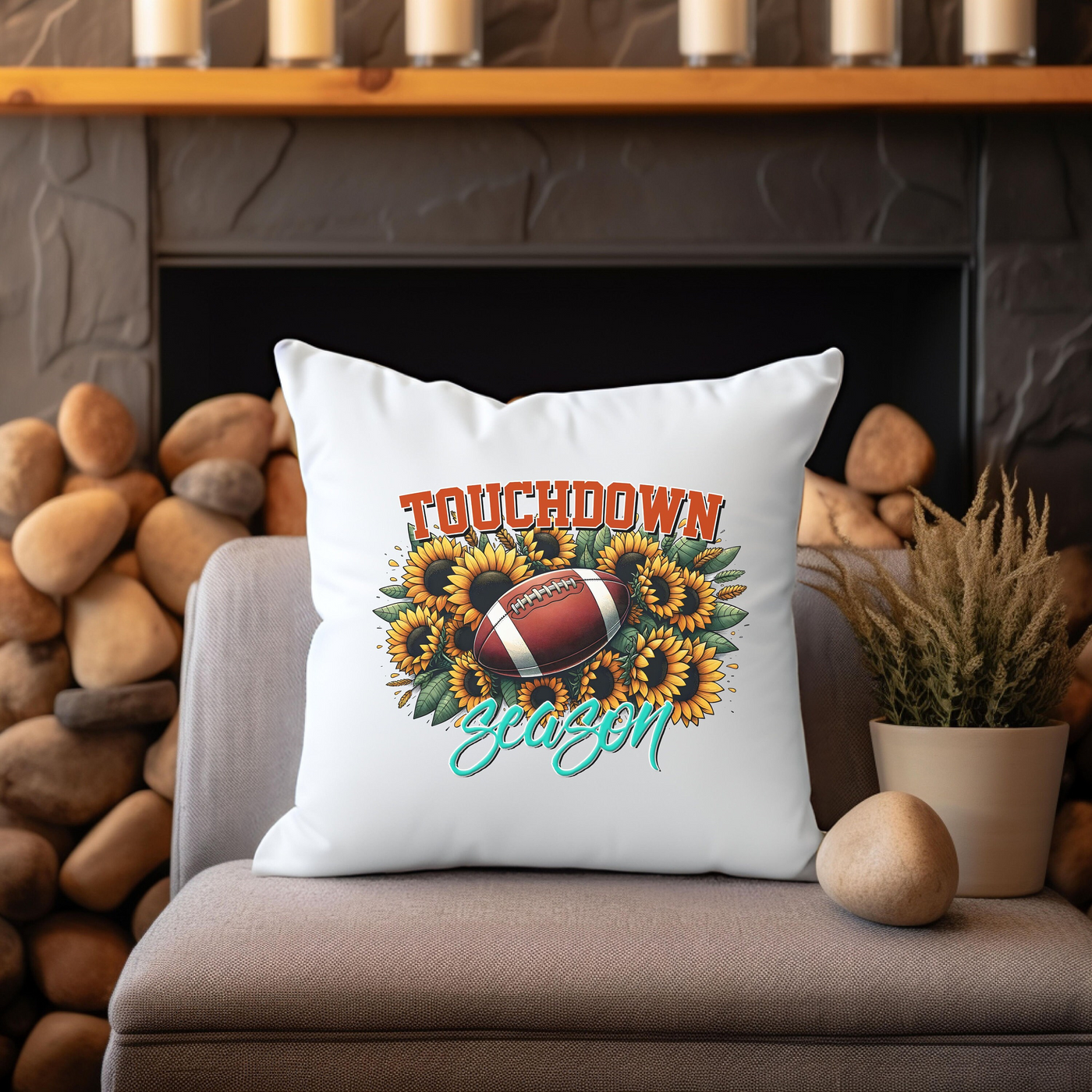 a throw pillow sitting on a couch next to a potted plant