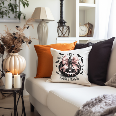 a living room with a white couch and pillows