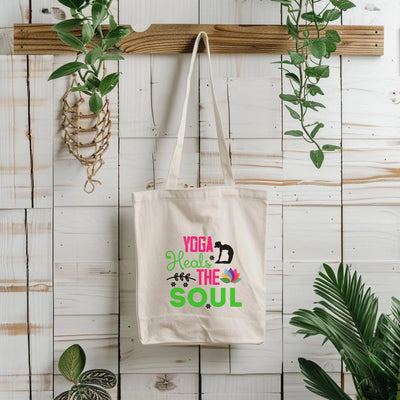 a tote bag hanging on a wall next to a potted plant