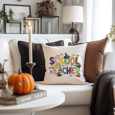 a white couch topped with pillows and a candle