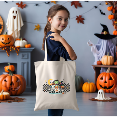 a little girl holding a trick or treat bag