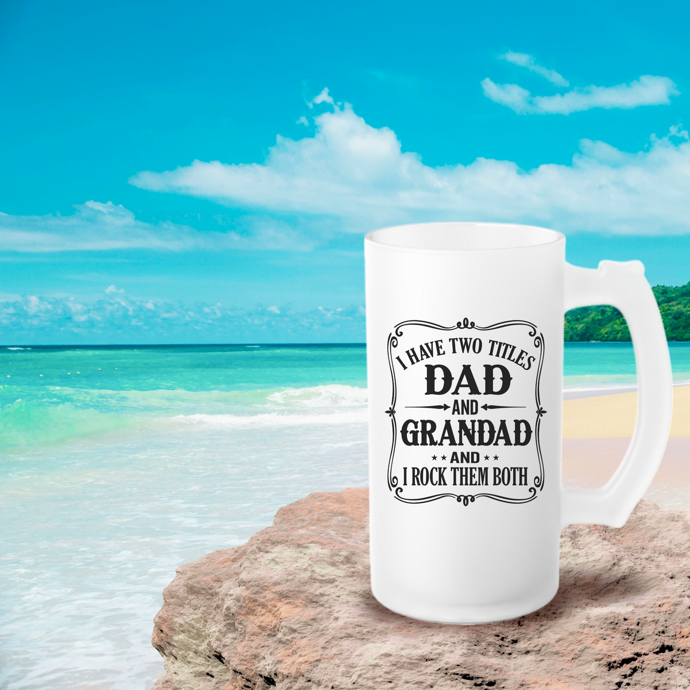 a white coffee mug sitting on top of a beach