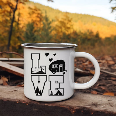 a camper mug sitting on top of a wooden table