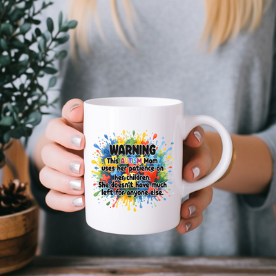 a woman holding a coffee mug with a message on it