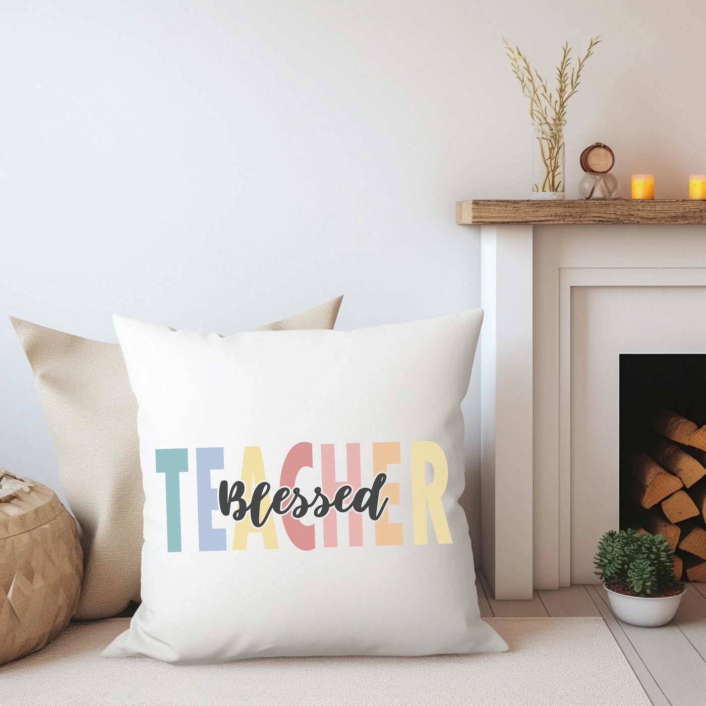 a white pillow with the word teacher printed on it