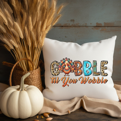 a decorative pillow with the words gobble til you wobble