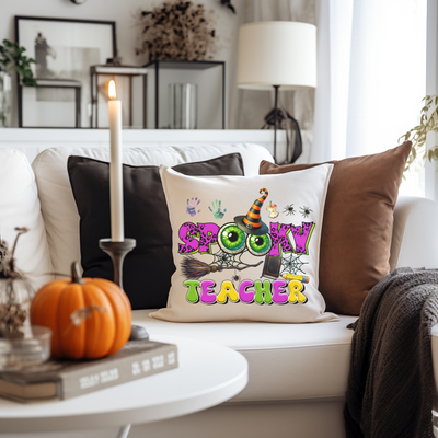 a white couch with a halloween pillow on it