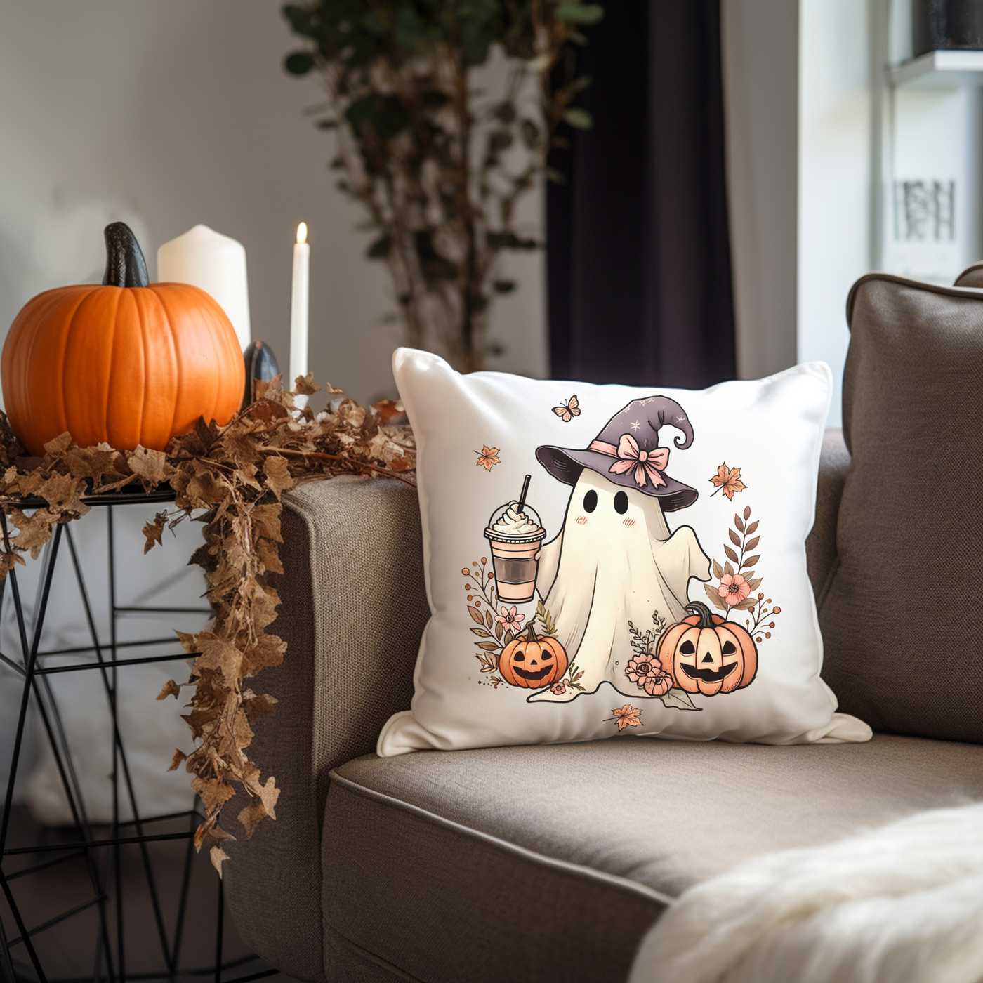 a pillow with a ghost on it sitting on a couch