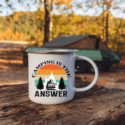 a camper mug sitting on top of a tree stump