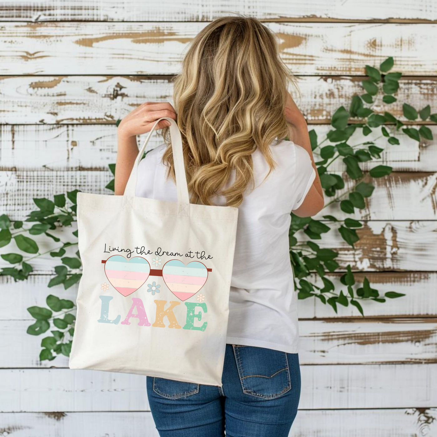 a woman carrying a bag with the words lake printed on it