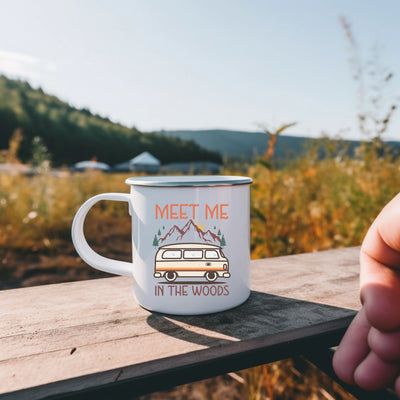 a person holding a coffee mug with a camper on it