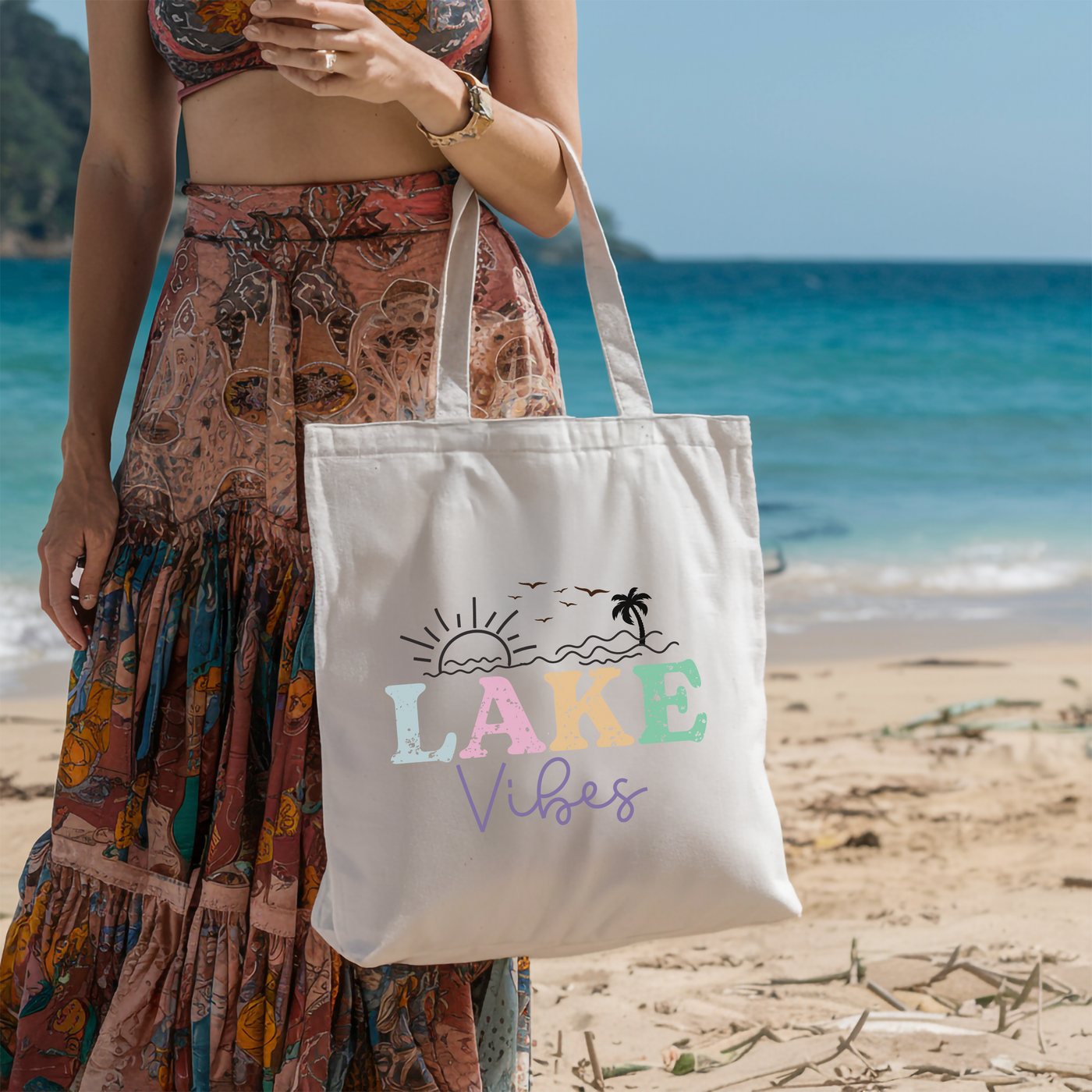 a woman standing on a beach holding a white bag