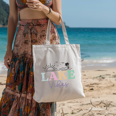 a woman standing on a beach holding a white bag