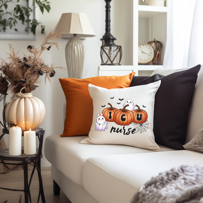 a living room with a white couch and pillows