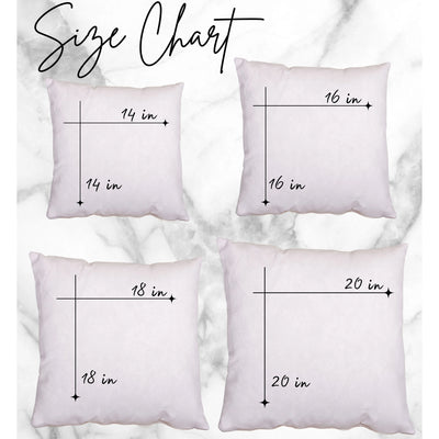 three white pillows with numbers on them on a marble background