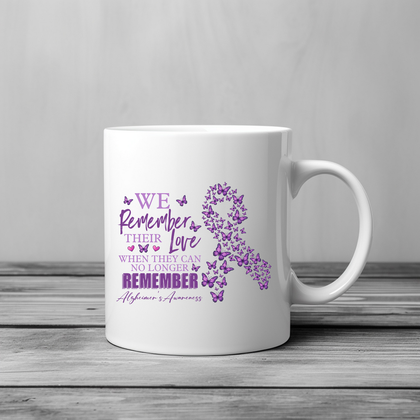 a white coffee mug with a purple ribbon on it