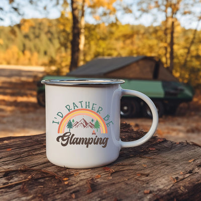 a camper mug sitting on top of a tree stump