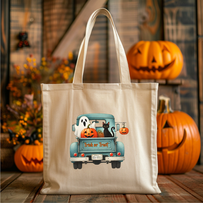 a tote bag with a picture of a truck with pumpkins and a cat